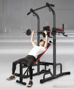 מתח מקבילים בטן +ספסל משקולות בחור עובד על הספסל