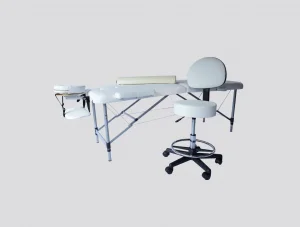 חדר טיפולים: מיטת אלומיניום, כיסא למטפל וכרית חצי עגולה – צבע לבן